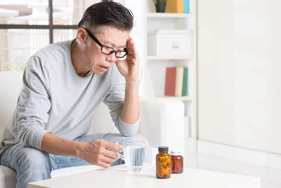 Mature Asian man headache